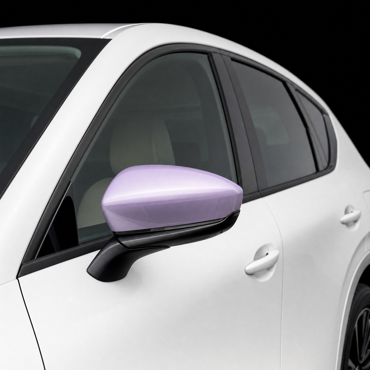 Pre-cut mirror cap protection film shown tinted lilac on the door mirror of a white Mazda CX-60