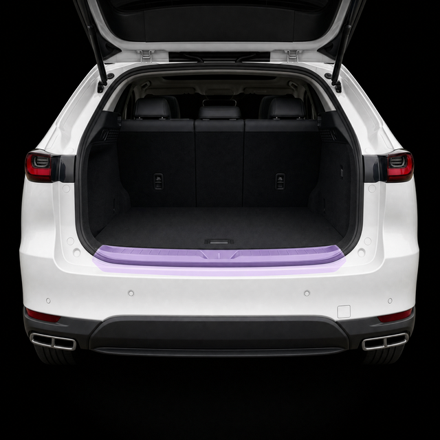 Pre-cut luggage sill protection film shown tinted lilac on the boot loading lip of a white Mazda CX-60