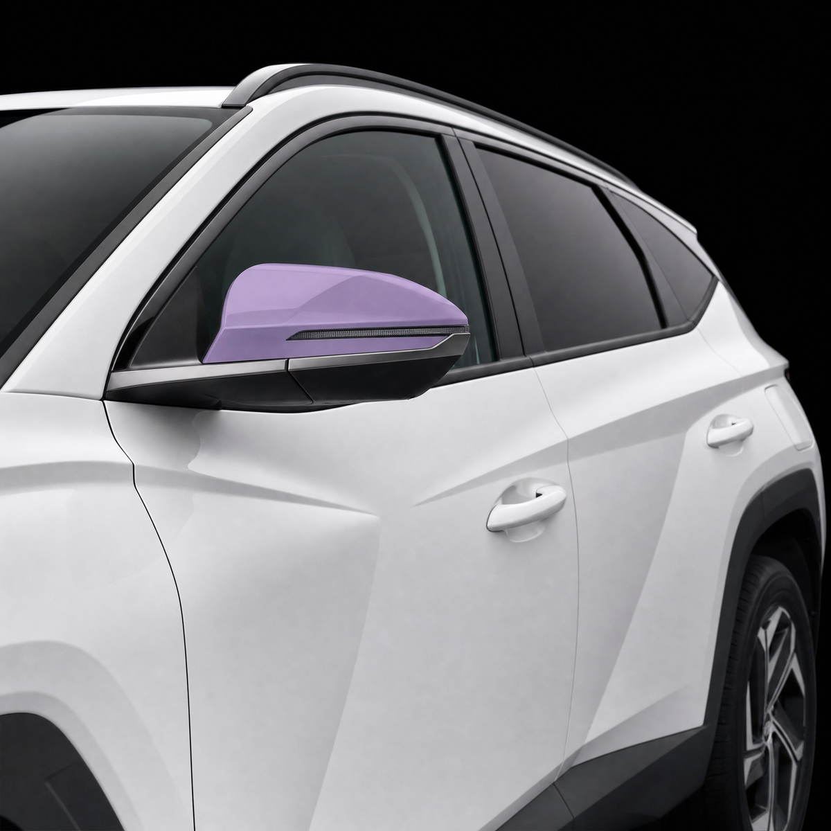 Pre-cut mirror cap protection film shown tinted lilac on the door mirror of a white Hyundai Tucson