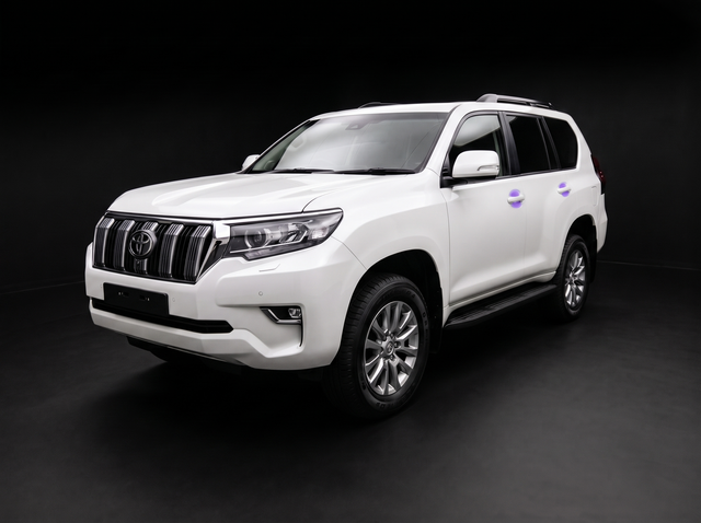 Pre-cut door handle cup protection film shown tinted purple on the door handles of a white Toyota LandCruiser Prado 2020-2023