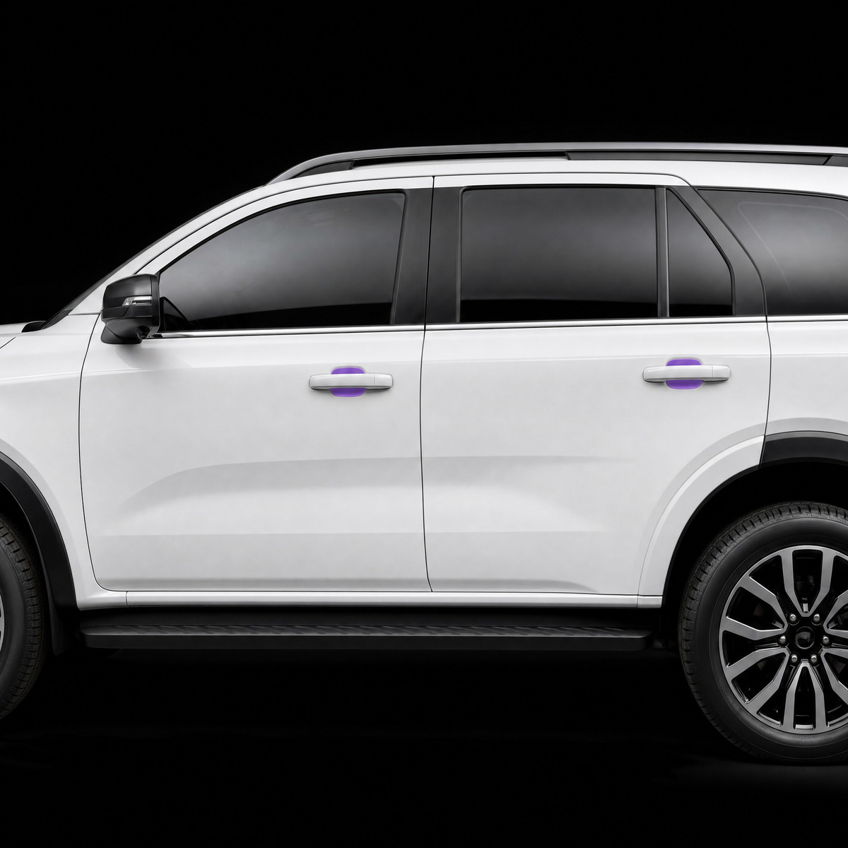 Ford Everest door handle cups on both doors with pre-cut PPF shown in translucent purple