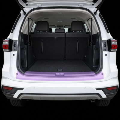 Pre-cut luggage sill protection film shown tinted lilac on the boot loading lip of a white Isuzu MU-X