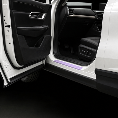 Pre-cut door sill protection film shown tinted lilac on the lower sill of a white Mazda CX-60