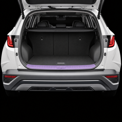 Pre-cut luggage sill protection film shown tinted lilac on the boot loading lip of a white Hyundai Tucson