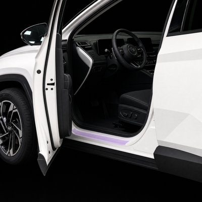 Pre-cut door sill protection film shown tinted lilac on the lower sill of a white Hyundai Tucson