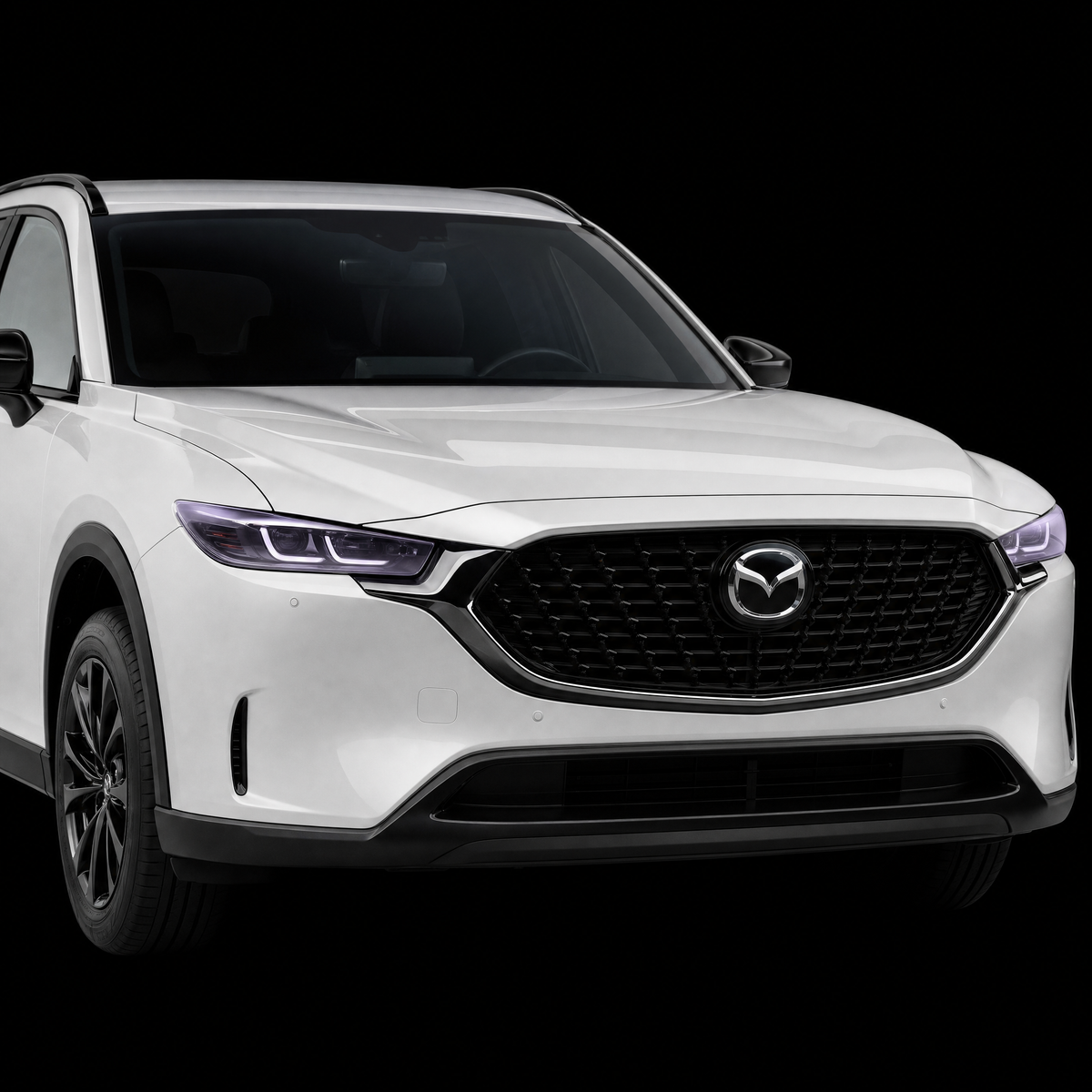 Pre-cut headlight protection film shown tinted lilac on the headlights of a white Mazda CX-5 2026