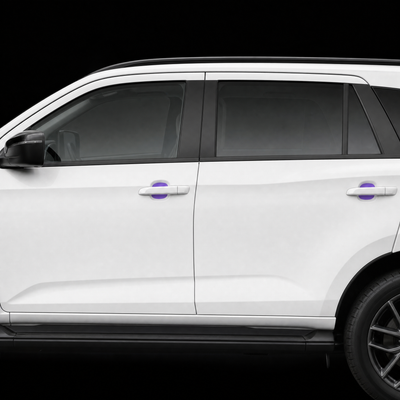 Pre-cut door handle cup protection film shown tinted purple in both door cups of a white Isuzu MU-X