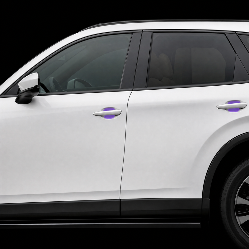 Pre-cut door handle cup protection film shown tinted purple in both door cups of a white Mazda CX-60